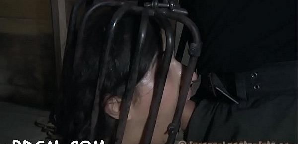  Serf has to wear a metal cage helmet  during cunt torturing